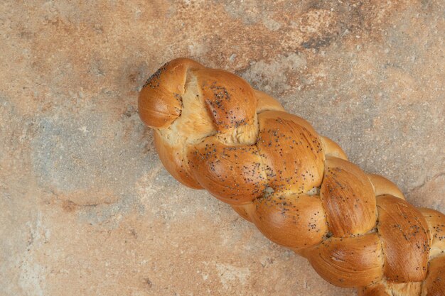 Fresh white bread on marble surface