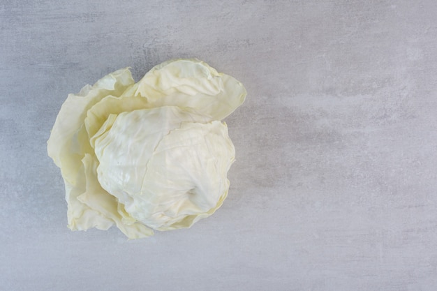 Fresh white cabbage on stone surface. High quality photo