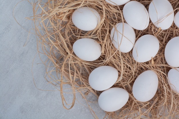 Fresh white eggs on marble background. 