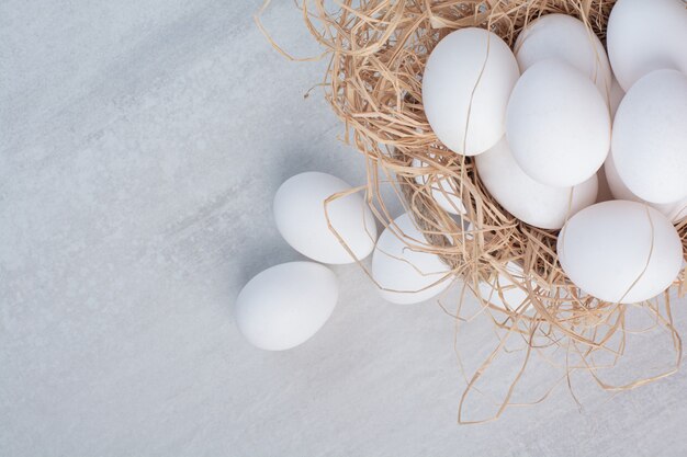 Fresh white eggs on marble background. 