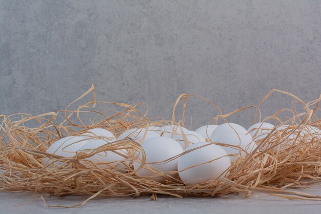 Fresh white eggs on marble background. 