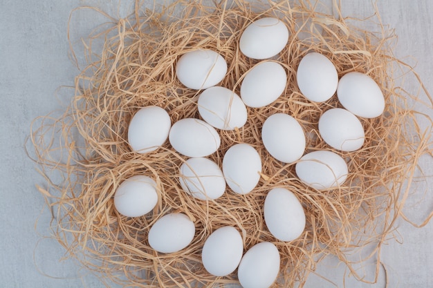 Fresh white eggs on marble background. 