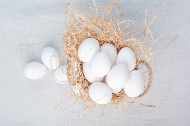 Fresh white eggs on marble background. 