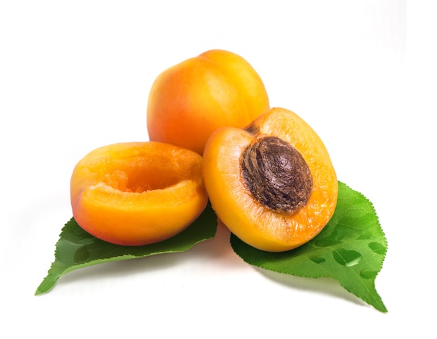 Fresh yellow apricots with green leaf