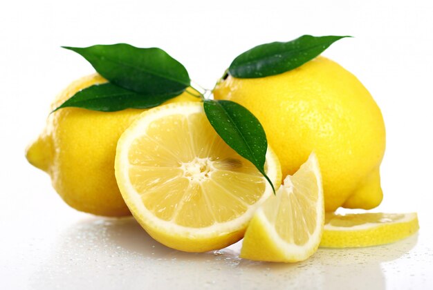 Fresh yellow lemons on white
