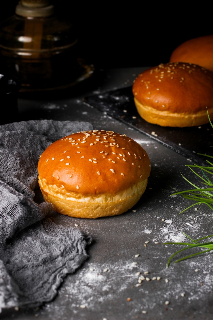 Free Photo freshly baked burger bun encrusted with sesame