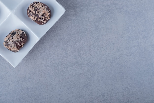 Freshly baked cookies on white plate