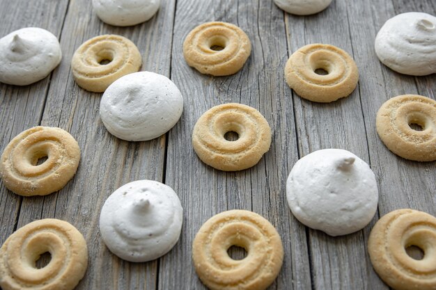 Freshly baked gingerbread cookies and bizet on a wooden table close-up