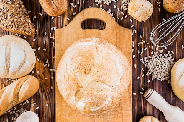 Freshly round baked on chopping board with sunflower seeds