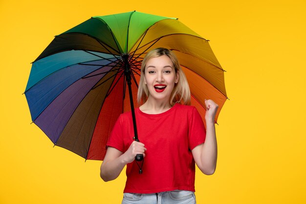 Frevo brazilian festival blonde pretty girl super happy holding rainbow umbrella