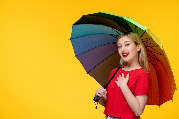 Frevo cute blonde girl celebrating brazilian festival holding chest and umbrella
