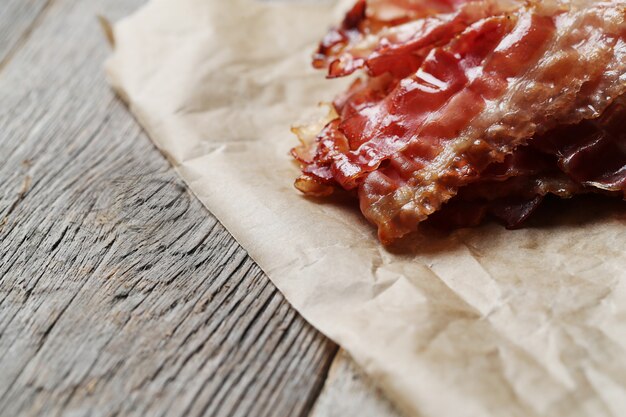 Fried bacon on brown paper