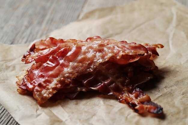 Fried bacon on brown paper