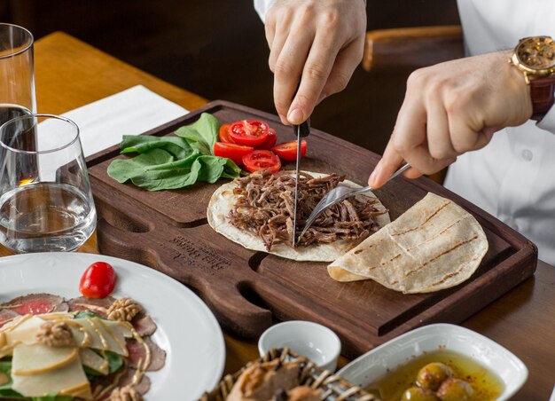 fried beef in lavash on the table