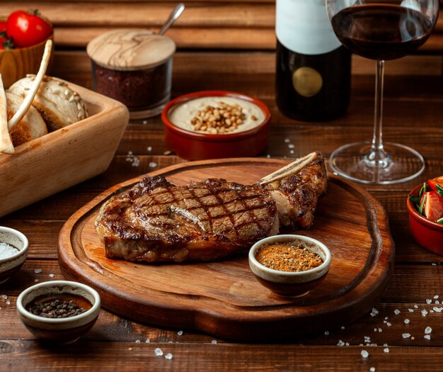 Fried beef steak on wooden board