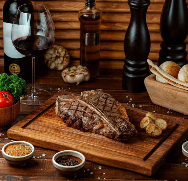 Fried beef steak on wooden board