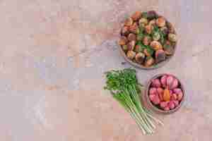 Free photo fried caucasian khinkali with herbs and a cup of marinated foods