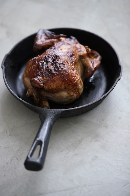 Fried chicken in black pan