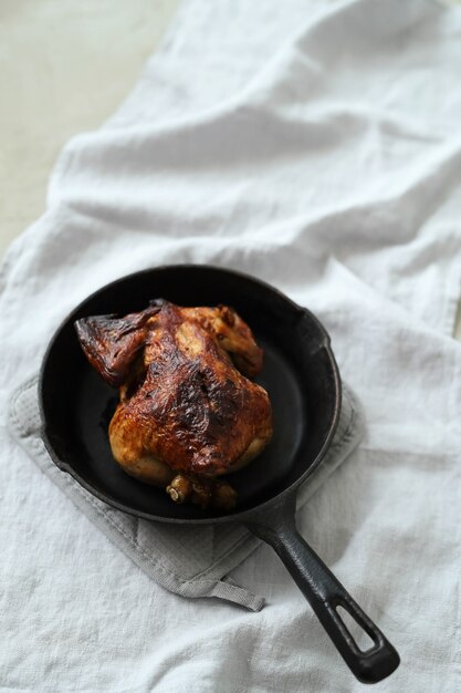 Fried chicken in black pan