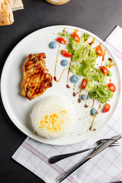 Fried chicken breast served with rice