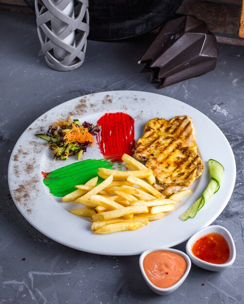 Fried chicken breast with french fries