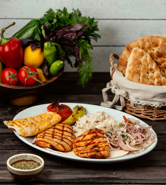 Fried chicken breast with vegetables on the table