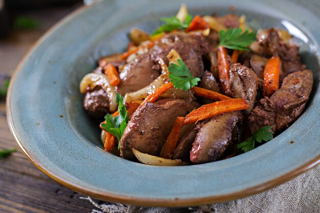 Fried chicken liver with vegetables. Healthy food.