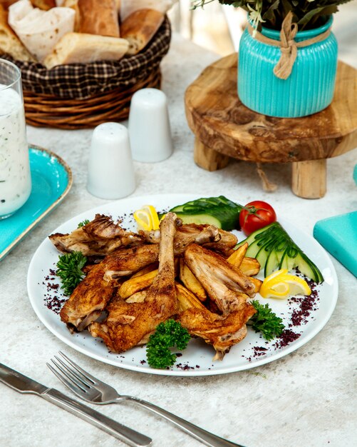 Fried chicken pieces and salad