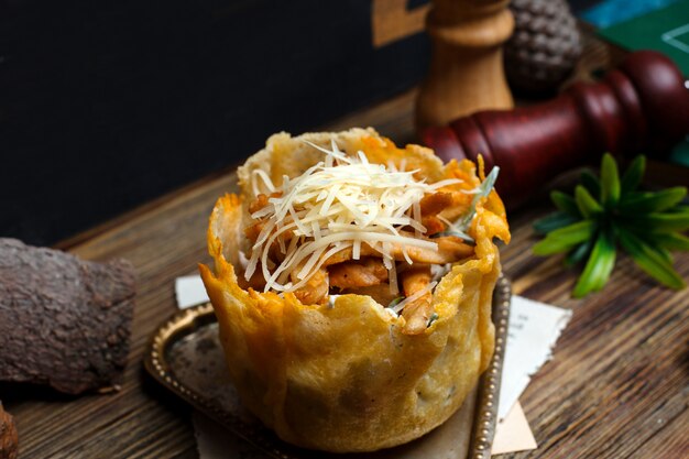 Fried chicken slices in crispy dough