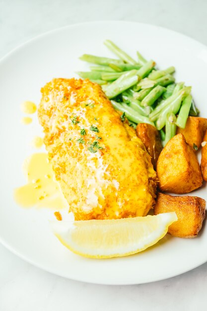 Fried chicken steak with lemon and vegetable