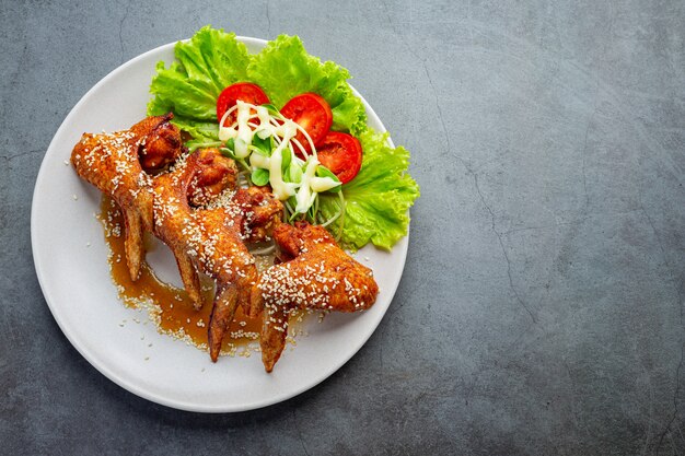 Fried chicken wings with fish sauce and sweet fish sauce.