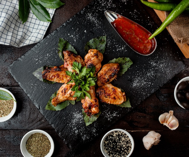 Fried chicken wings with sauce top view