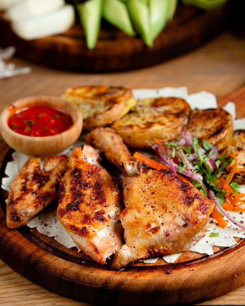 Fried chicken with potatoes on the table