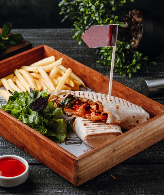 Free photo fried doner in lavash with french fries