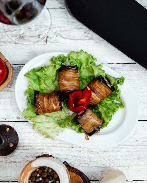 Fried eggplant rolls with side greenery