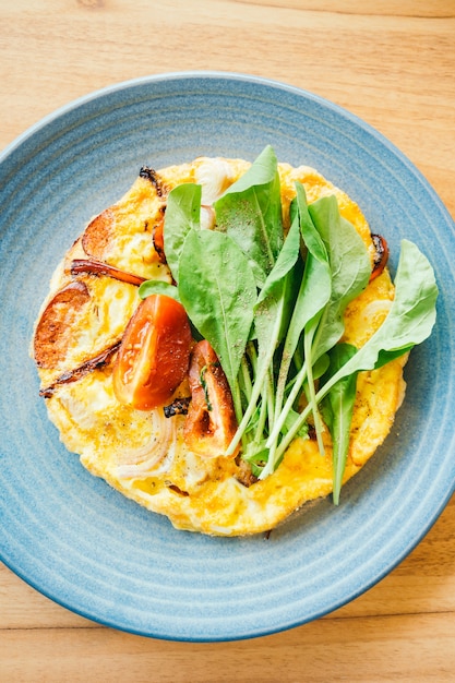 Fried eggs omelette in white plate