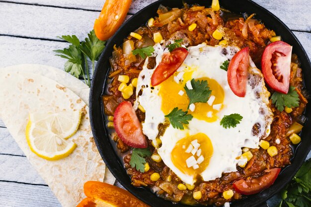 Fried eggs on traditional mexican dish