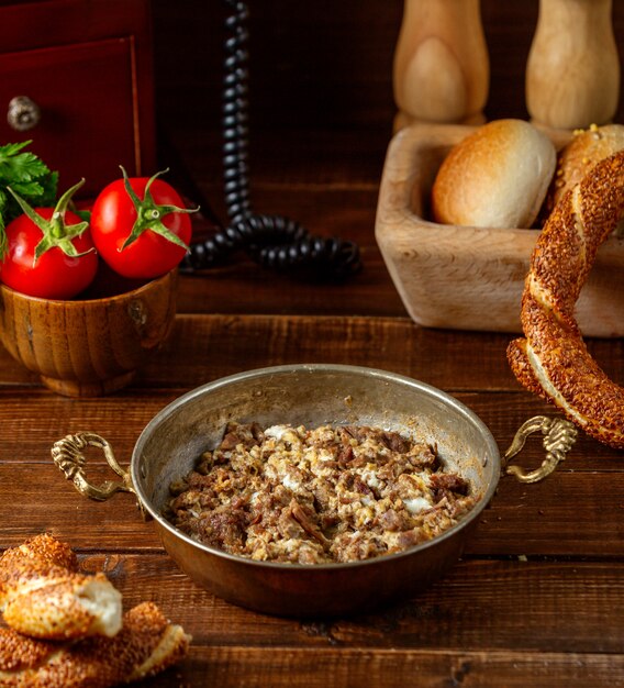 Fried eggs with meat on the table