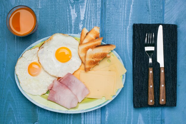 Fried eggs with toast ham and cheese