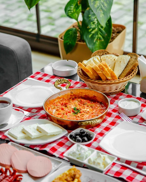 fried eggs with tomatoes and greenery