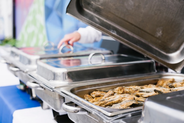 Fried fish served on metal box