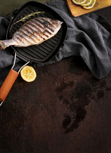 Fried fish with rosemary and lemon