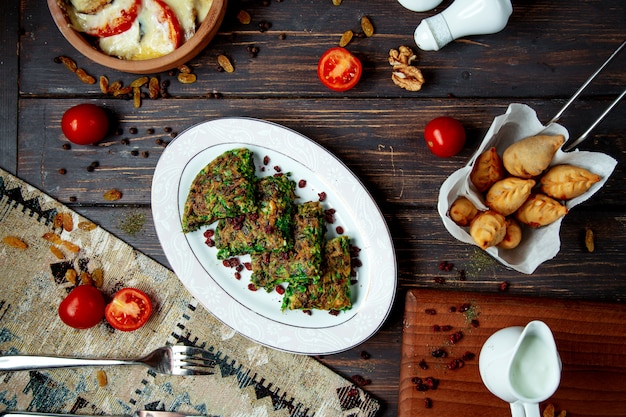 Fried gyurza with stuffed meat and kyukyu