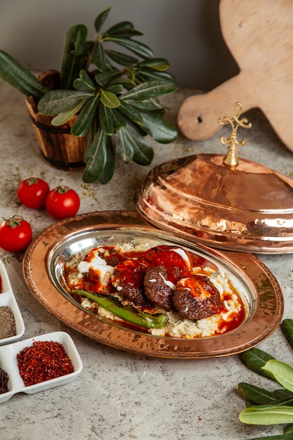 Fried meat served with sauce and grilled pepper