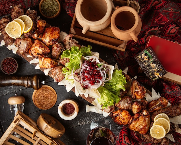 Fried meat set with sliced onion and pomegranate