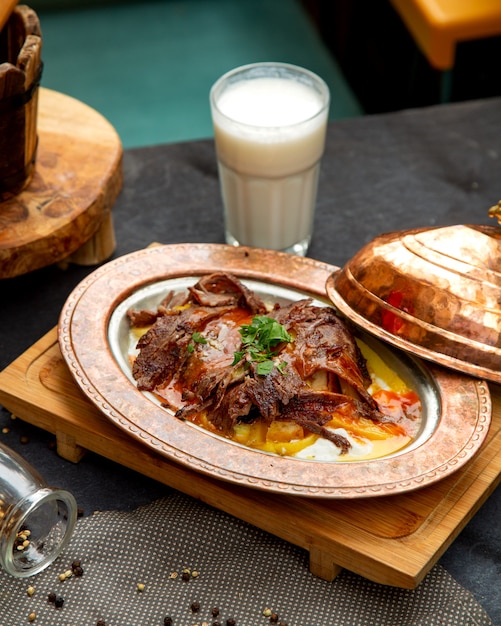 Fried meat slices served with ayran