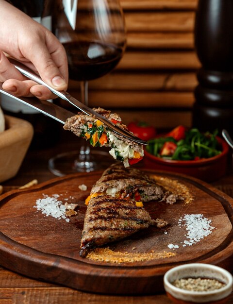 Fried meat steak on wooden board