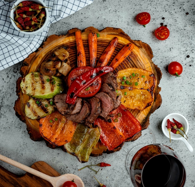 Fried meat with vegetables on the table