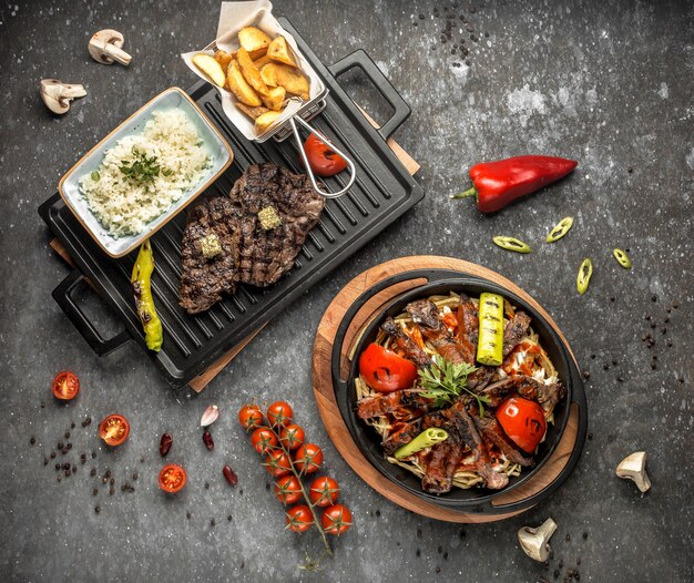 Fried meat with vegetables on the table