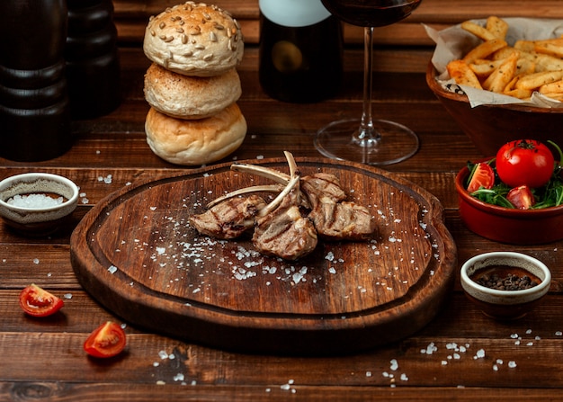 Fried meat on wooden board